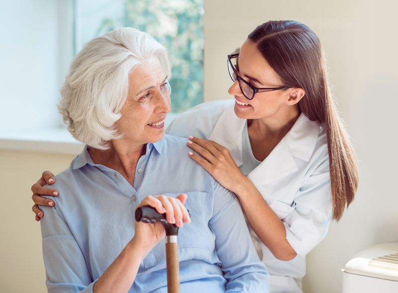 Young woman helping senior